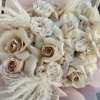 This bouquet features a mesmerizing array of soft beige roses, each one