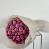 A captivating bouquet adorned with elegant purple roses. A purple rose bouquet