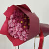 A captivating bouquet adorned with elegant purple roses. A purple rose bouquet