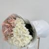 Half adorned with blush pink roses and half with pristine white blooms