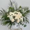 A serene arrangement where the timeless elegance of white roses harmonizes with
