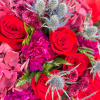 This bouquet is like a vibrant celebration of bold red roses mingling