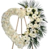 This funeral heart is delicately crafted from pristine white roses, carnations, hydrangea