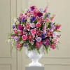 Extravagant, beautiful and comforting, this generously scaled arrangement eloquently expresses your sympathy