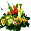 This lively and textured arrangement bursts with personality, blending vibrant red tulips
