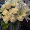 This arrangement is designed in a heavy luxury faceted vase.  It
