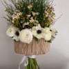 a stunning arrangement featuring a harmonies blend of vibrant blooms and soft