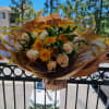 Ivory Whisper is a timeless bouquet featuring elegant white roses nestled among