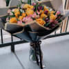  a stunning bouquet of vibrant yellow roses mixed with delicate pink