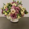 The soft pink and creamy whites give a peaceful and elegant vibe.