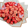 This lush bouquet of red and pink roses is a radiant expression