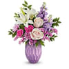 t, presented in a stunning lavender mercury-inspired sculpted glass vase-a timeless centerpiece