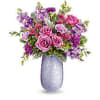  crafted from hand-blown art glass with an iridescent finish, radiating elegance