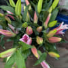 An assortment of 3 lilies and other fillers