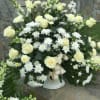 A PERFECT WAY TO SHOW YOUR CONDOLENCES.
ALL WHITE IMPORTED ROSES, CUSHIONS AND