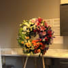 ABSOLUTELY STUNNING- FIVE STAR FUNERAL WREATH.
A BEAUTIFUL DESIGN OF STARGAZERS, ROSES, BELLS