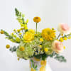 Bursting with citrusy charm, this arrangement brings all the sunshine! Featuring zesty