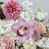 This stunning pastel pink arrangement, elegantly displayed in a pink Kendall vase