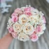 Classic round bouquet with pink and white roses.