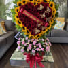 Spectacular floral arrangement in wooden box, consisting of red roses, sunflowers and