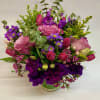 This lovely and  heartwarming arrangement features Roses, lisianthus, tulips, wax flower