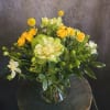 This citrusy and summery arrangement is perfect to bring a bright and