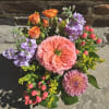 Pearlescence is a captivating arrangement designed in the colors of peach, pink