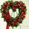 Our Red Sympathy Heart Wreath is a stunning display of warmth and