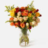 Layers of golden yellow, burnt orange, crimson, and blush roses unfold like