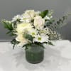 A soft arrangement in white and green, &ldquo;Pretty in White&rdquo; evokes the