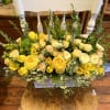 This bright and wild arrangement features 3 vases in one rectangular wooden