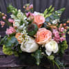 A beautiful and lush centerpiece for an elegant table. Featuring roses, tulips