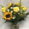 This arrangement includes everyone&#039;s favorite Sunflowers and Roses. There is just enough