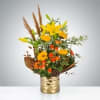 Autumn glimmer is a quintessential fall arrangement featuring a gold architecture vase