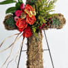 A natural  moss- covered cors adorned with vibrant orange roses, accent
