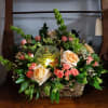 roses, mini roses, bell of Ireland, astros, wax flowers, greenery with lighted