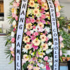 Funeral Standing Pink Peach and Yellow with Greenery.
Draping Ribbon with Custom Message