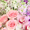 Different shades of pinks and lavender in a rustic wooden box. A