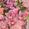 A plush and vibrant romantic arrangement of different shades of pink flowers