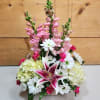 Blooms of Beauty Basket is a stunning floral arrangement that captures the