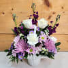 Express your heartfelt sympathy with a graceful arrangement of peaceful lavender and