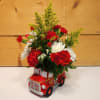 Celebrate the arrival of a little one with this charming floral arrangement