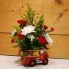 Celebrate the arrival of a little one with this charming floral arrangement