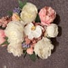 A alluring basket of soft, touchable SILK peonies with the addition of