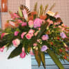An amazing tribute for your loved one in pinks, lavenders, and greens.