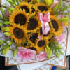 Fresh, bold, and beautiful 
Our hand-wrapped bouquet of Sunflowers, Lilies &amp; Roses