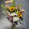 A radiant burst of elegance featuring cheerful sunflowers, lush hydrangeas, graceful lilies