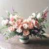 A beautiful and soft, peach tone of garden blooms are gathered in