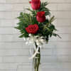 Three roses arranged together make for a perfect centerpiece. Rose colors may