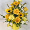 Beautiful assortment of fresh blooms designed in a watering tin. COLOR OF